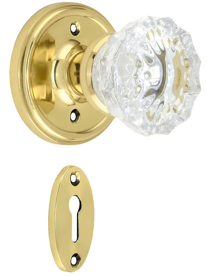 Classic Rosette Mortise Lock Set With Fluted Crystal Door Knobs in Unlacquered Brass.